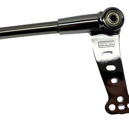 Metal mechanical component with 'DTK' branding on a gray background